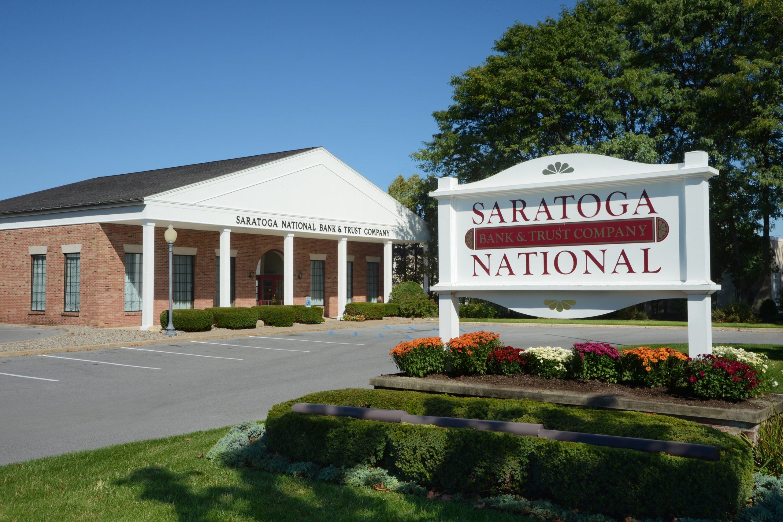 saratoga national bank front of building with sign in view