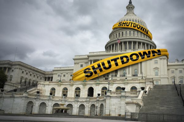USA shutdown and United States government closed and american federal shut down due to spending bill disagreement between the left and the right pas a national finance symbol with yellow hazard tape in a 3D illustration style.