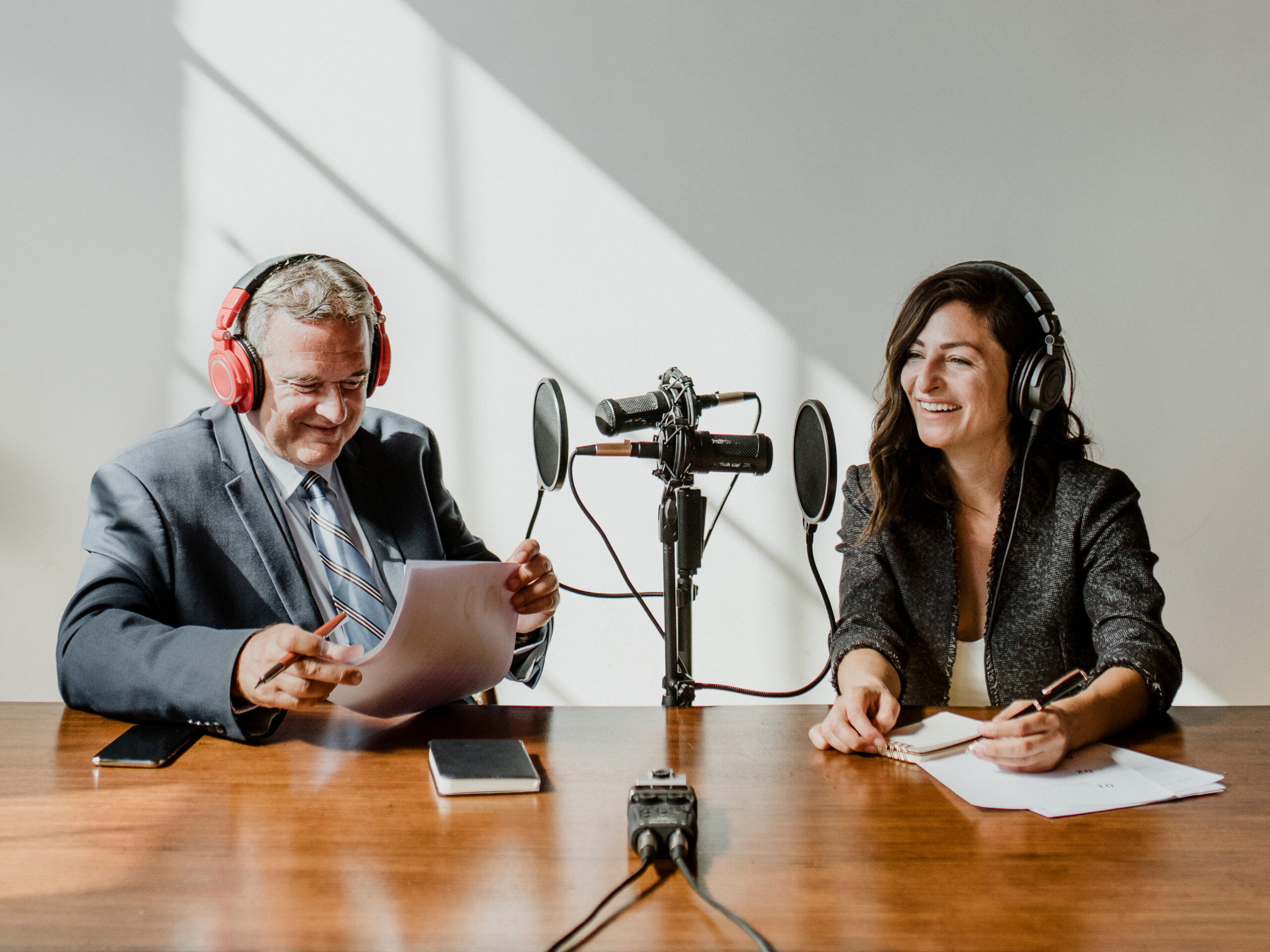 Female broadcaster interviewing her guest in a studio