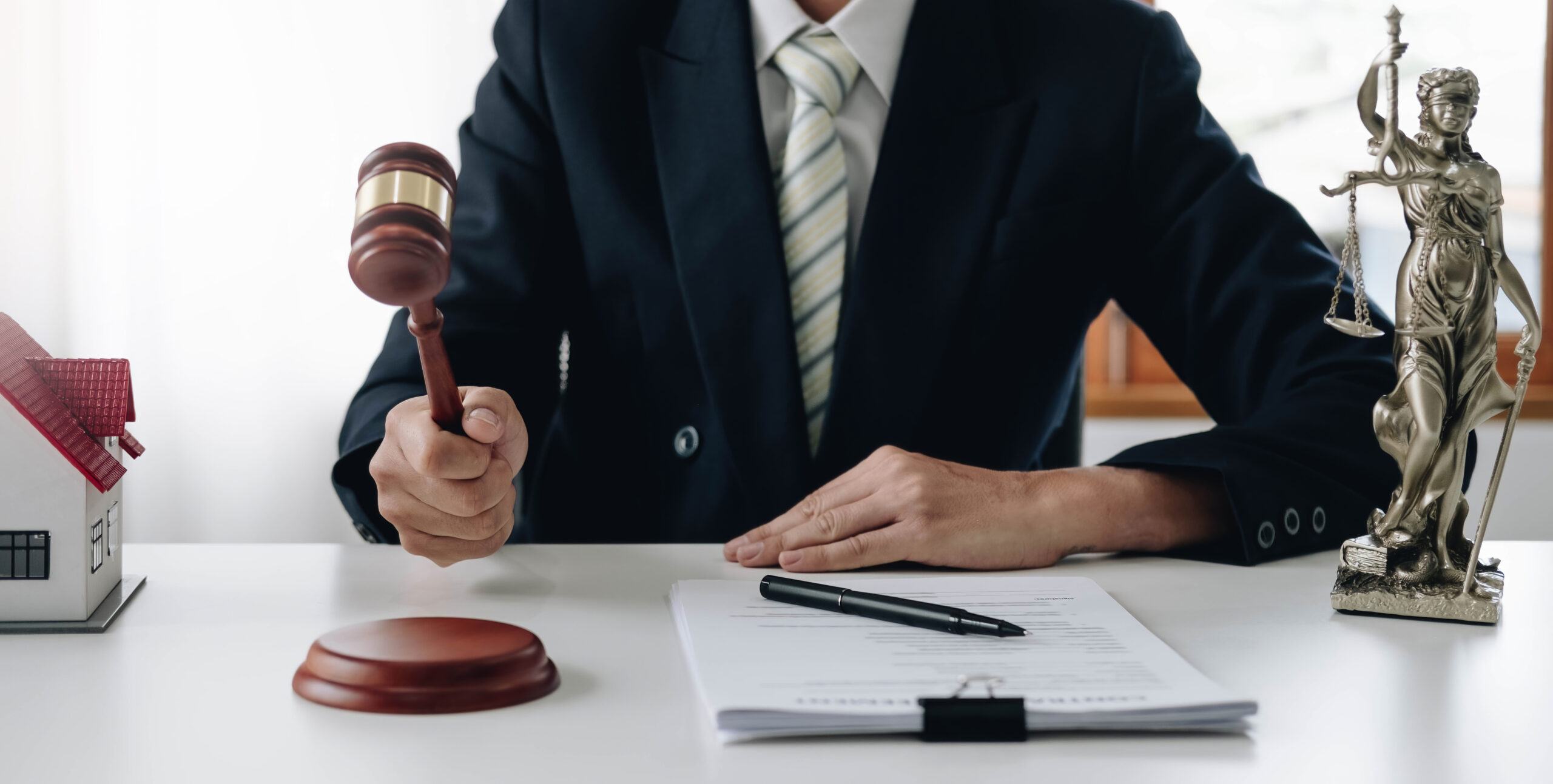 Lawyer or judge holding Hammer prepares to judge the case with justice, and litigation, scales of justice, law hammer, Legal consulting services, Concept of litigation, and legal services.