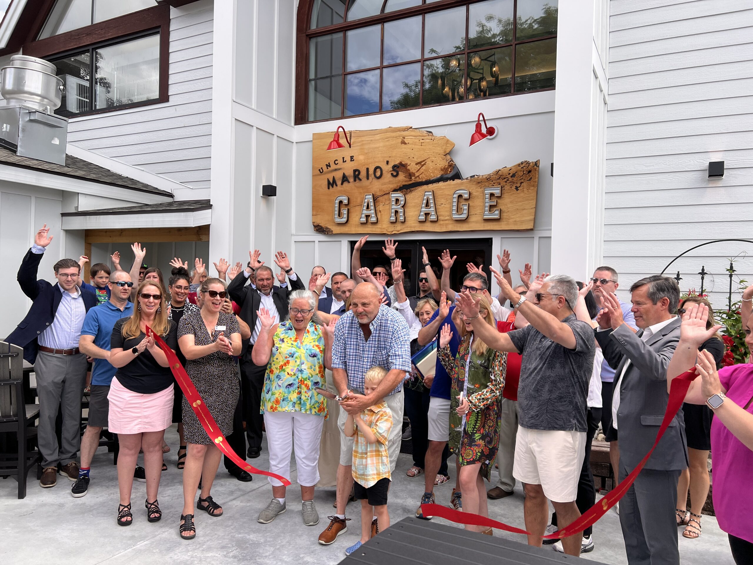 uncle marios garage ribbon cutting