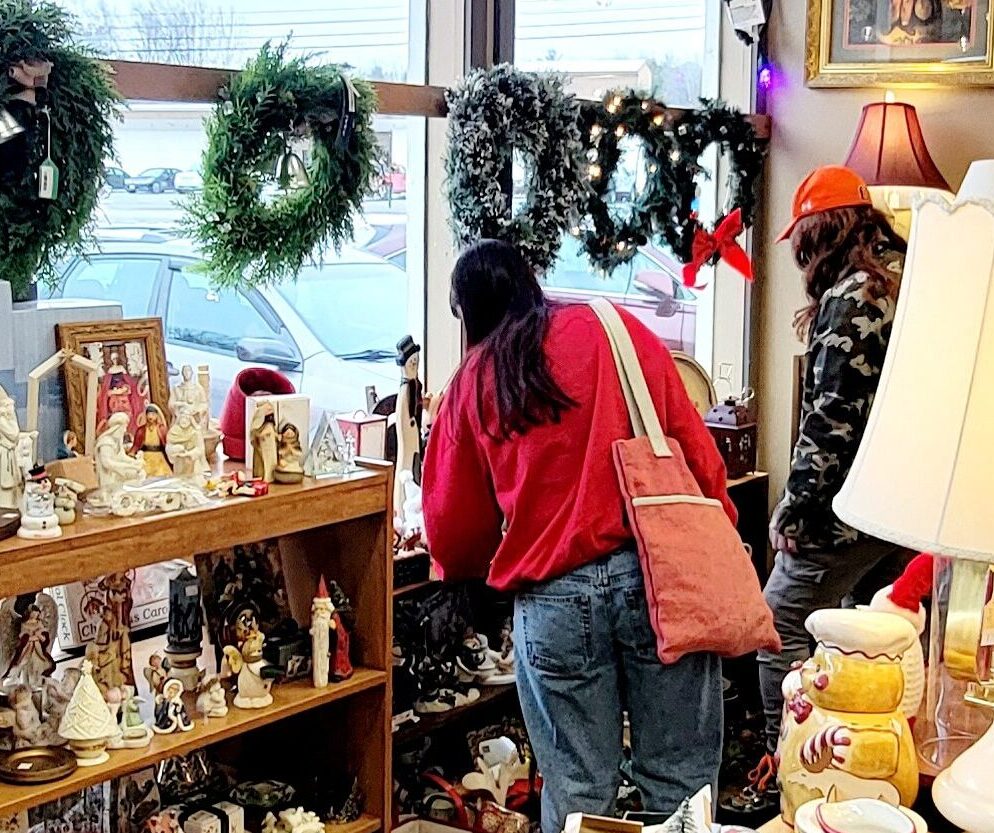 people shopping at a christmas store