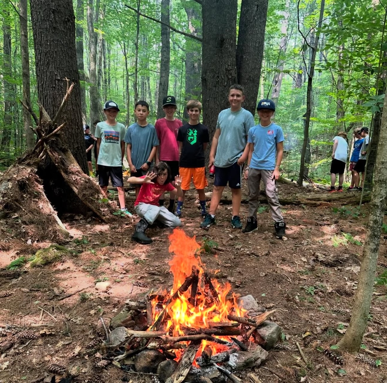 group of children around a campfire