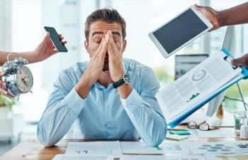 Portrait of a young businessman looking stressed out in a demanding office environment