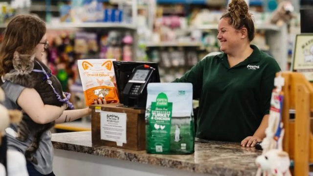 Customer purchasing pet supplies at store