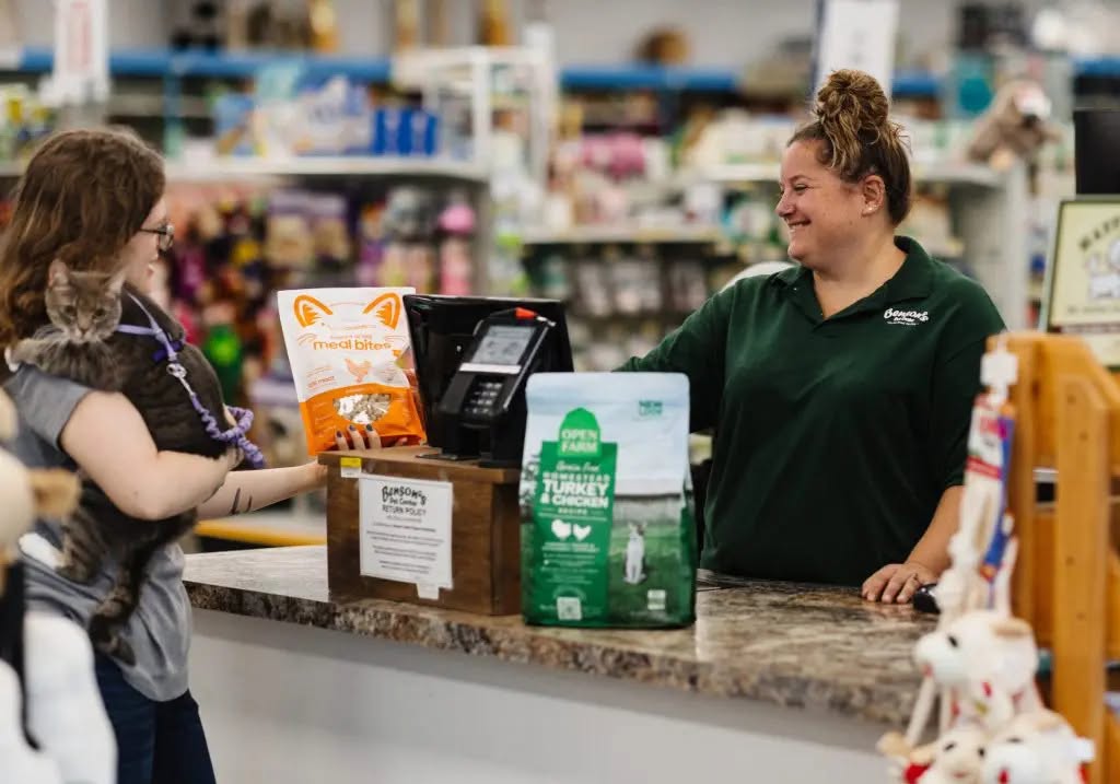 Customer purchasing pet supplies at store