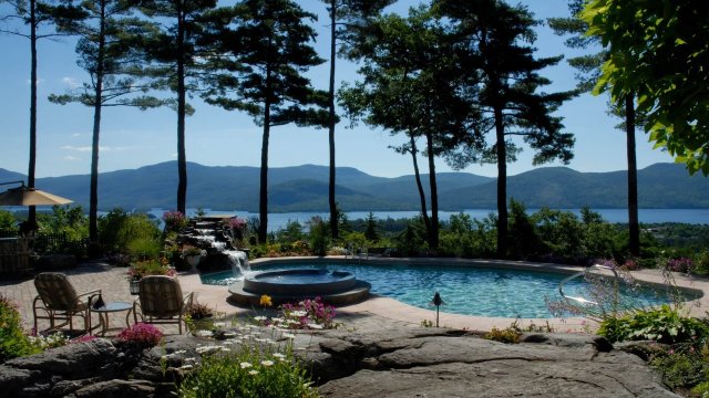 pool on the lake with mountains in the back