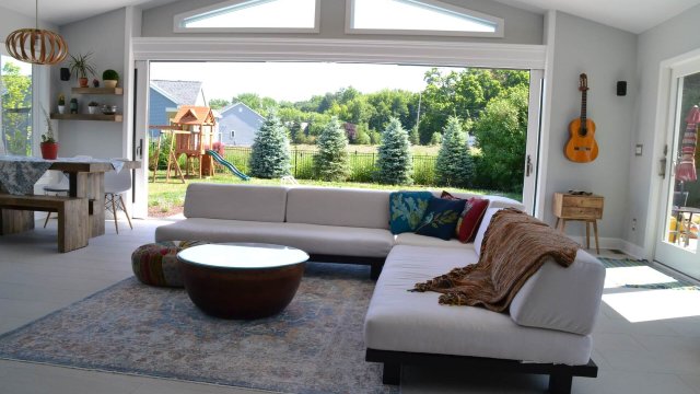 Bright, modern living room with greenery