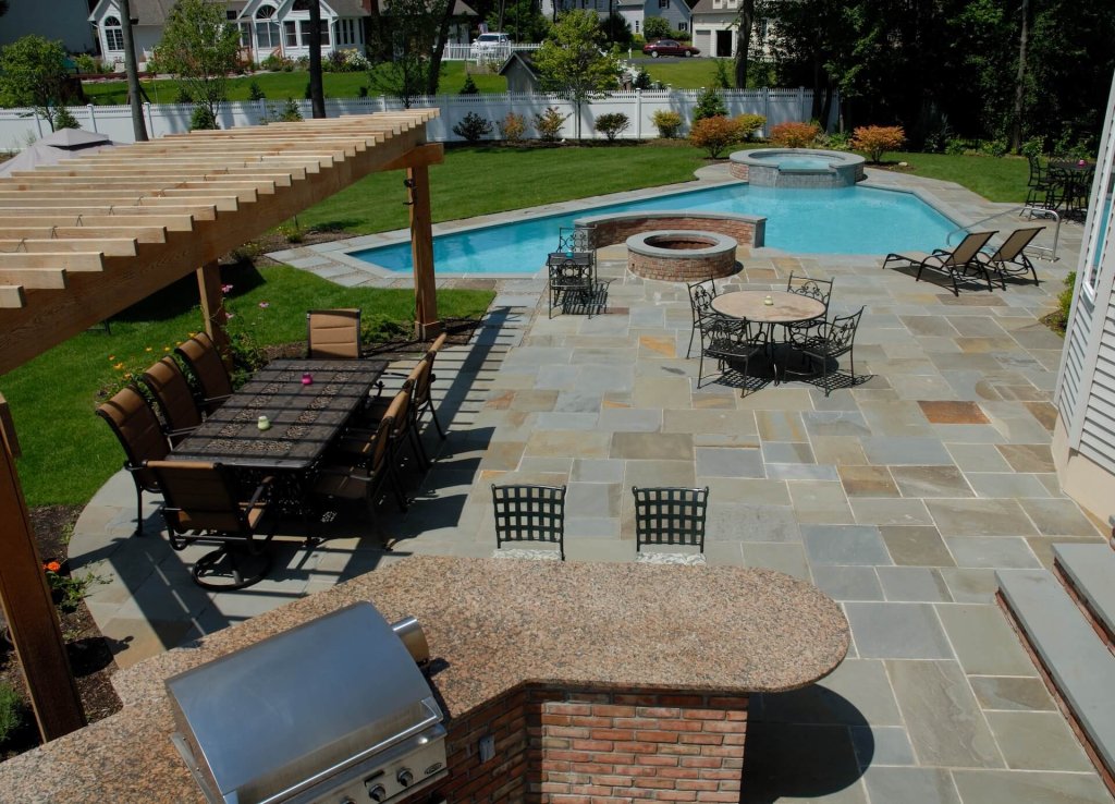 Backyard pool with patio and seating