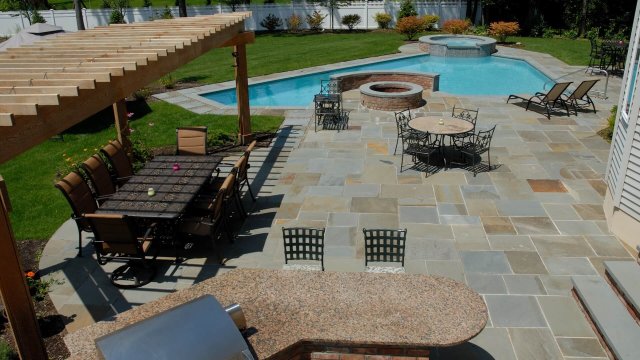 Backyard pool with patio and seating