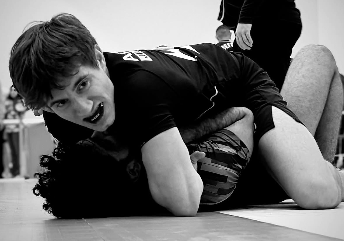 two kids fighting in black and white
