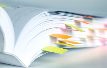 Open book with colorful bookmarks